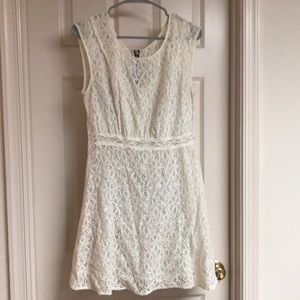 White lace dress with zipper detail on the back